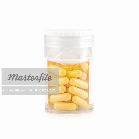 yellow pills isolated on a white background