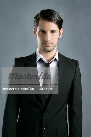 Fashion trendy elegant young black suit man posing looking camera