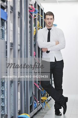 young handsome business man  engeneer in datacenter server room