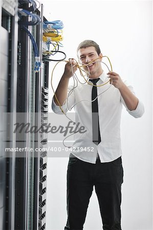 young handsome business man  engeneer in datacenter server room