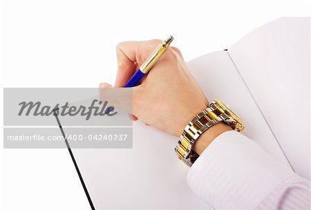 Close up of human hand with pen