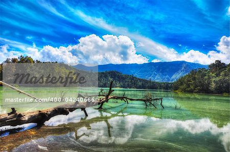 Volcanic lake Telaga Warna at plateau Dieng