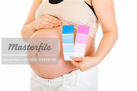 Pregnant woman holding colour paint samples isolated on white. Close-up.