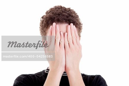 young man covering his face, isolated on white, studio shot