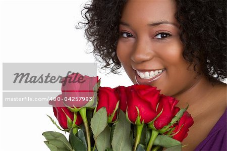 Beautiful black woman holding roses