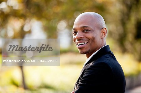 An African American business man with a big smile