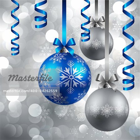 christmas blue and silver baubles on shining silver background