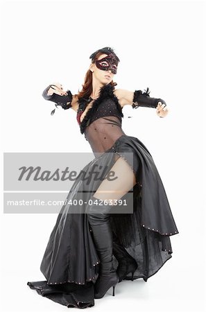 Dancing woman in a mask and the black dress, isolated