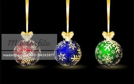 Three colored Christmas spheres on a black background