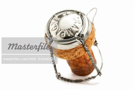 standing cork from a champagne bottle on white background