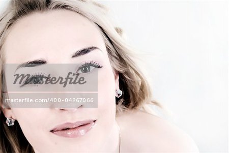 Portrait of a young seductive blond smiling