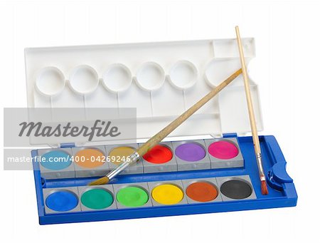 Box of watercolor paints and brushes on a white background, isolated