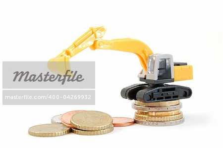 making euro money coins with digger isolated on white background