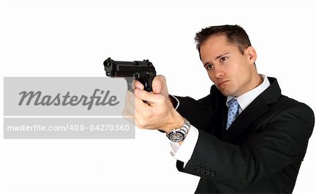 A handsome man in a business suit pointing his pistol at an object / person outside the picture