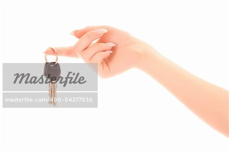 Woman hand with keys isolated on white