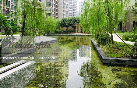 Central garden with water pond and summerhouse in a new Chinese residential district