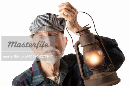 Apprehensive railroad man holding a glowing red lantern.