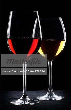 Two glasses of wine. One with red and the other with white