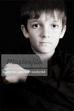 Young boy with big eyes in casual attire