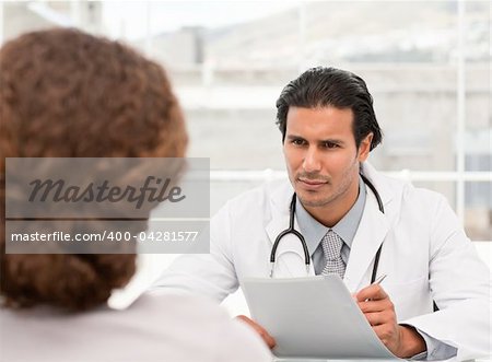 Charismatic doctor during an appointment with a female patient