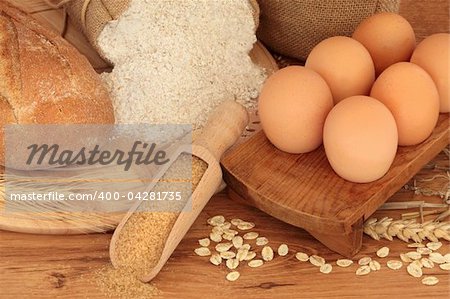 Natural food of egg, rye bread, granary flour, brown sugar with scatterd oat flakes, corn and wheat.