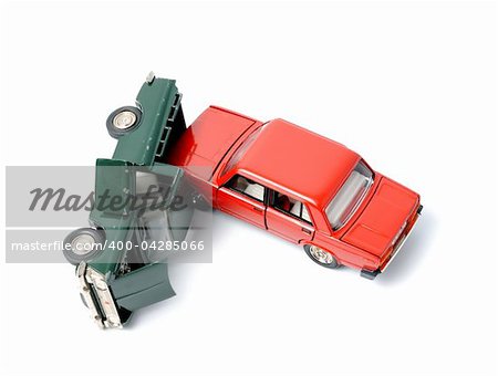 Toy cars in accident on a white background