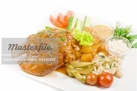 Tasty pork brisket dish with vegetables closeup