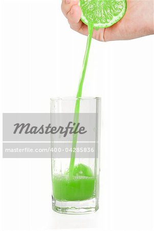 Fresh squeezed lime juice isolated on a white background