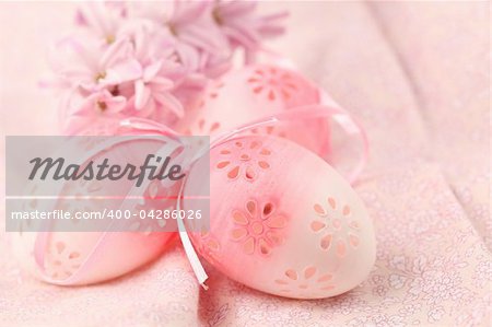 Pink flowery Easter eggs on pink background with hyacinth. Shallow dof