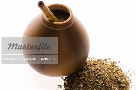 argentinian calabash with yerba mate isolated on white background