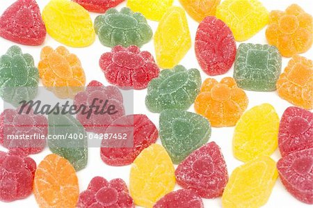 Multicoloured fruit jellies insulated on white background