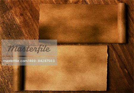 Ancient paper on wooden background
