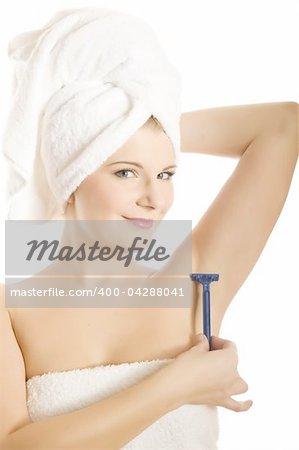 pretty woman shaving with razor