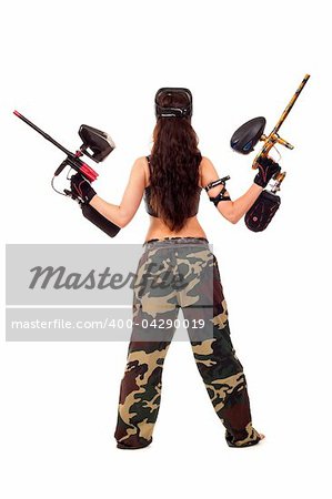 Sexy young girl posing like playing paintball