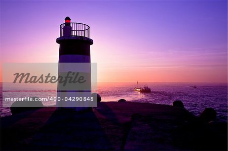 Beautiful landscape picture of a lighthouse at sunset