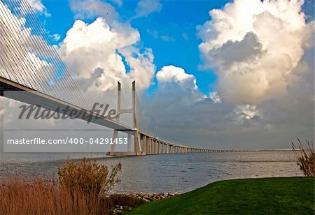 The new highway over the river Tagus in Lisbon, was commissioned in  April 1, 1998 g - to 500-th anniversary of explorer Vasco da Gama  sea route from Europe to India. Bridge - one of several large-scale  construction projects on the Iberian peninsula, made in  commemorate the 500 th anniversary of the discovery of America. The total length of the bridge Vasco da Gama, 17 km