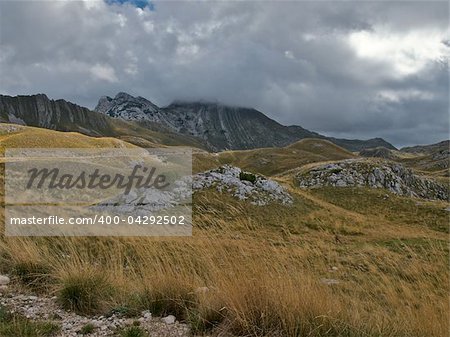 Prutas peak in National park Durmitor in Montenegro. Low nimbus clouds