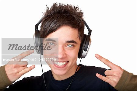 Male Teenager listening to music and smiles happy. Isolated on white background.