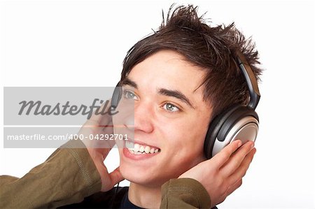 Male Teenager listening to music via headphone and sings. Isolated on white background.