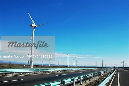 Wind turbine generators in sinkiang,china,with blue skies and white clouds as backgrounds