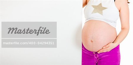 Pregnant woman holding blank billboard  isolated on white. Close-up.