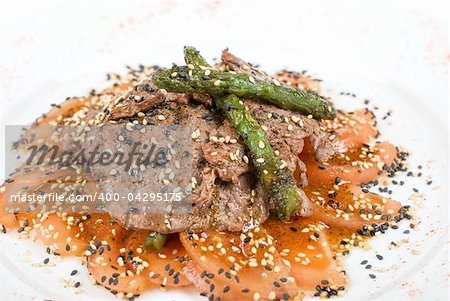 Salad from beef closeup with white mushrooms, string beans, asparagus, spinach, and tomatoes carpaccio