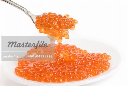 red caviar with spoon on a white background