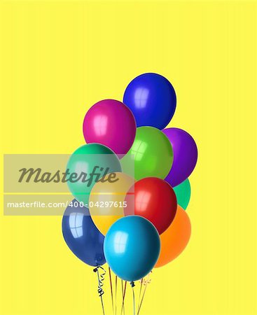 bunch of happy flying balls isolated on yellow background