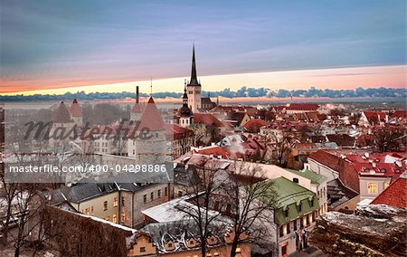 Overview of Tallinn in Estonia taken from the overlook in Toompea showing the town walls and churches. Taken in HDR to enhance the sunset