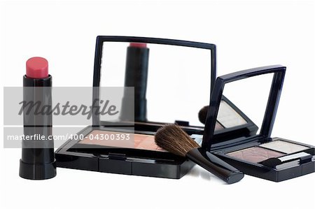 Red lipstick and eye shadow isolated over white background