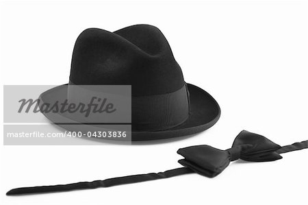 black vintage hat and bowtie on white background