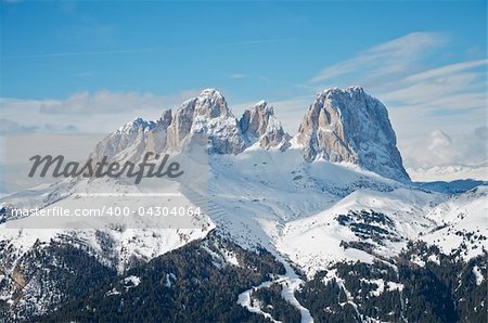 Sassolungo mountain range in the Dolomites, Italy. Blue sky.