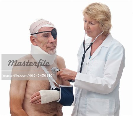 A woman doctor is using a stethoscope to listen to an old-man's heart. He has been badly injured in an accident. Isolated on white.