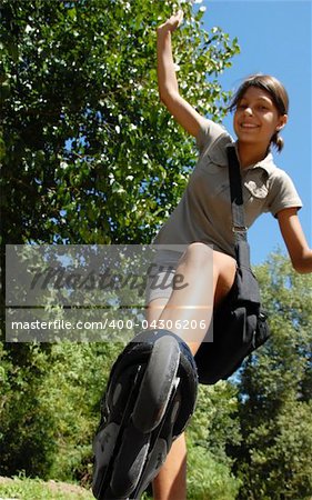 caucasian teenage girls having fun with rollers  outdoor in park at summer